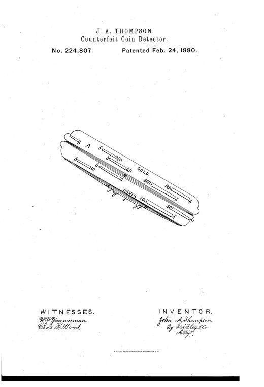 An elongated metal plate shown at an angle, marked 'GOLD' on one side with slots labeled for denominations 2½D, 5D, 10D, 20D, and 'SILVER' on the other side with slots labeled 10, 25, 50, and 1D, each slot tapering in width toward a central ridge running the length of the plate.