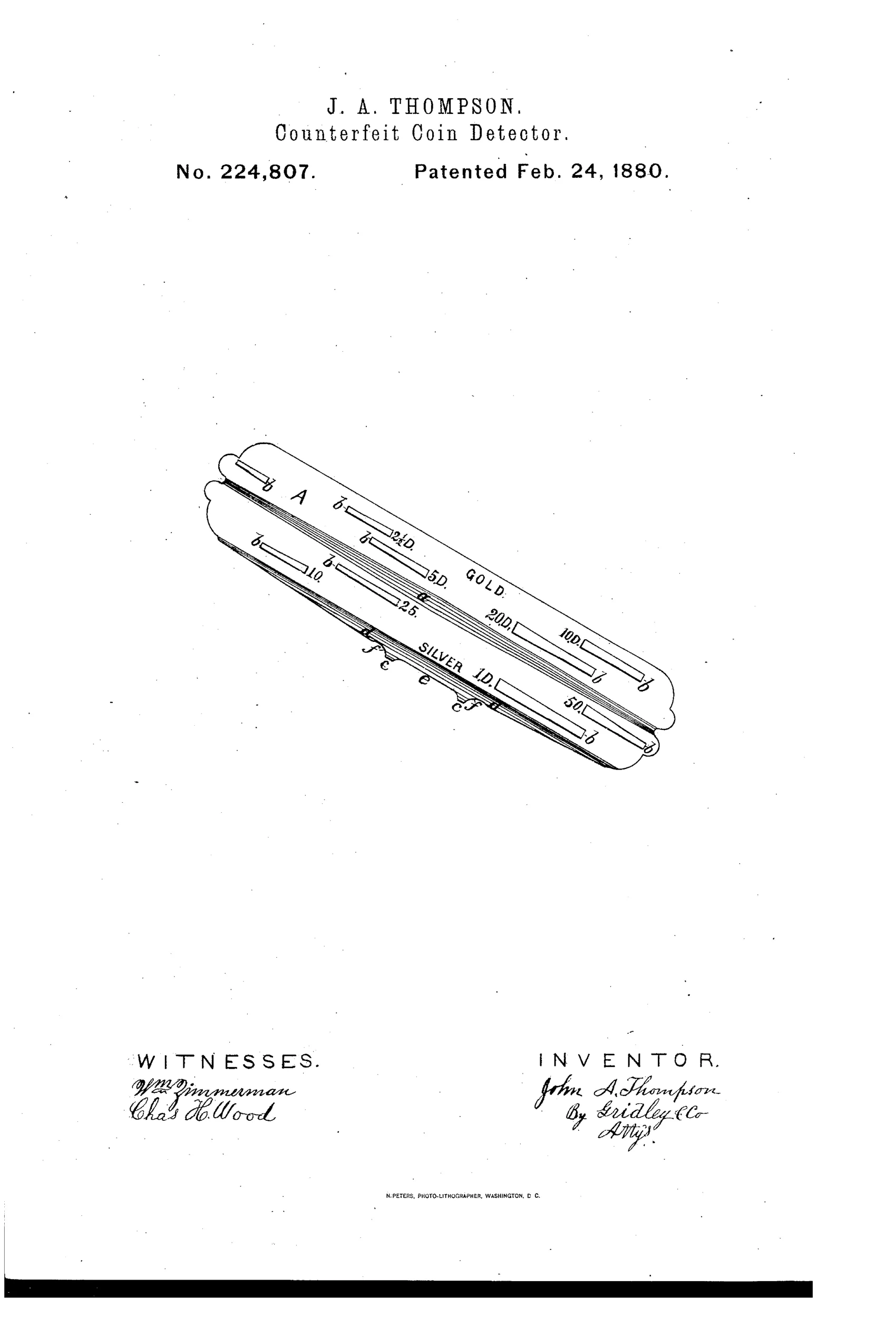 An elongated metal plate shown at an angle, marked 'GOLD' on one side with slots labeled for denominations 2½D, 5D, 10D, 20D, and 'SILVER' on the other side with slots labeled 10, 25, 50, and 1D, each slot tapering in width toward a central ridge running the length of the plate.